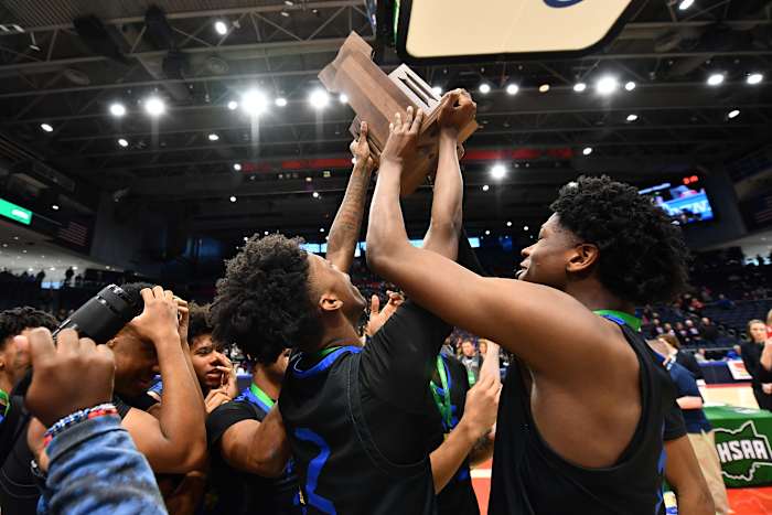 Richmond Heights players lift the 2023 OHSAA Division IV state championship trophy